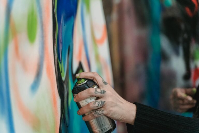 person holding a spray paint